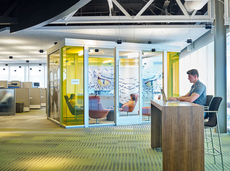 an office with an enclosed space created by movable partitions