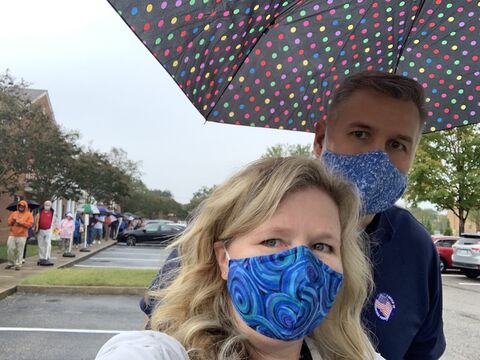 long voting line selfie in the rain