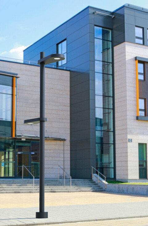 Multiple SiteLine luminaires are mounted to the same pole at different heights.